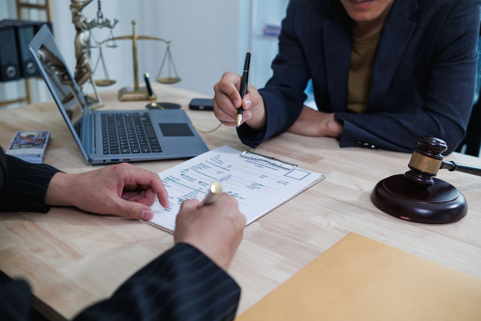 Client reviewing documents with an attorney