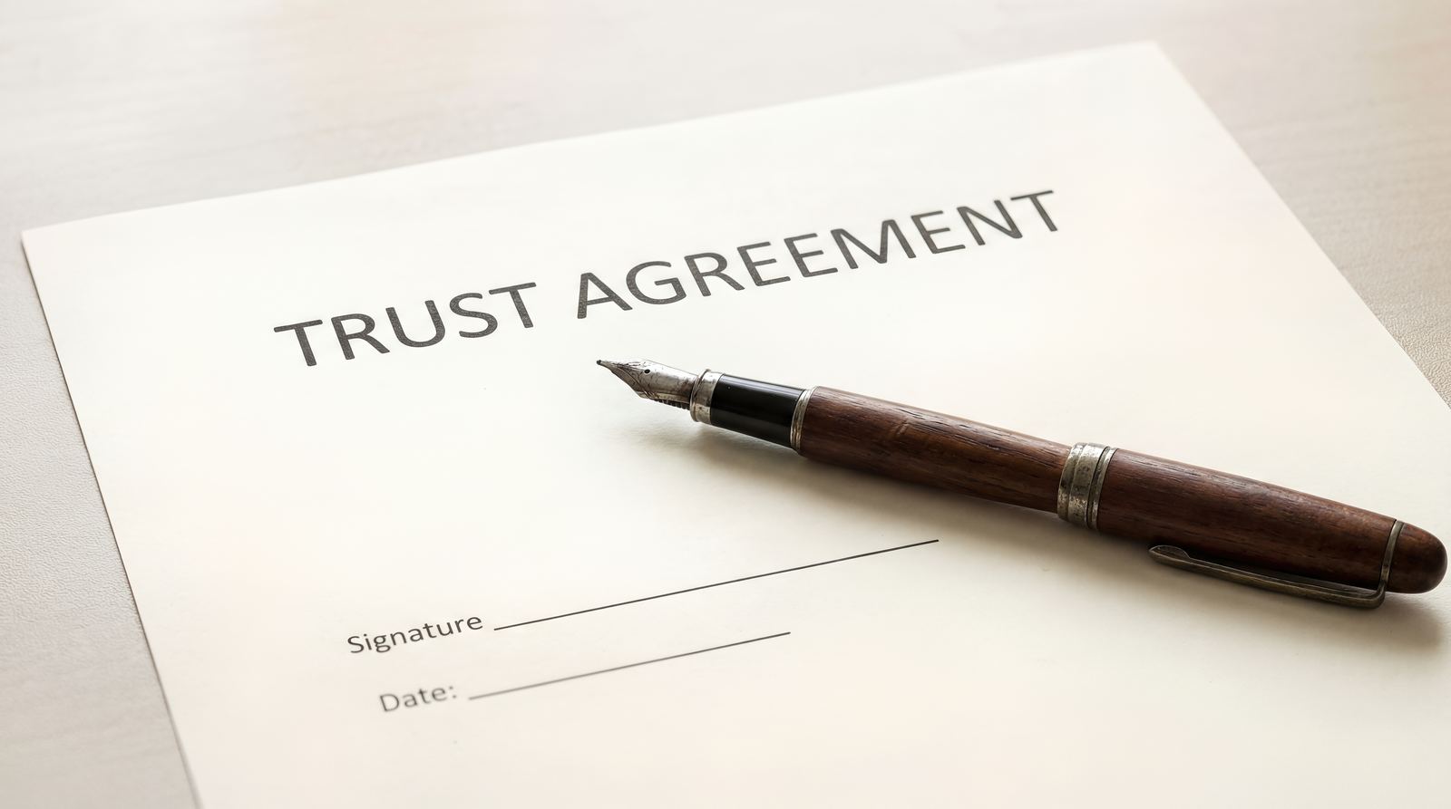 Trust agreement document with a fountain pen